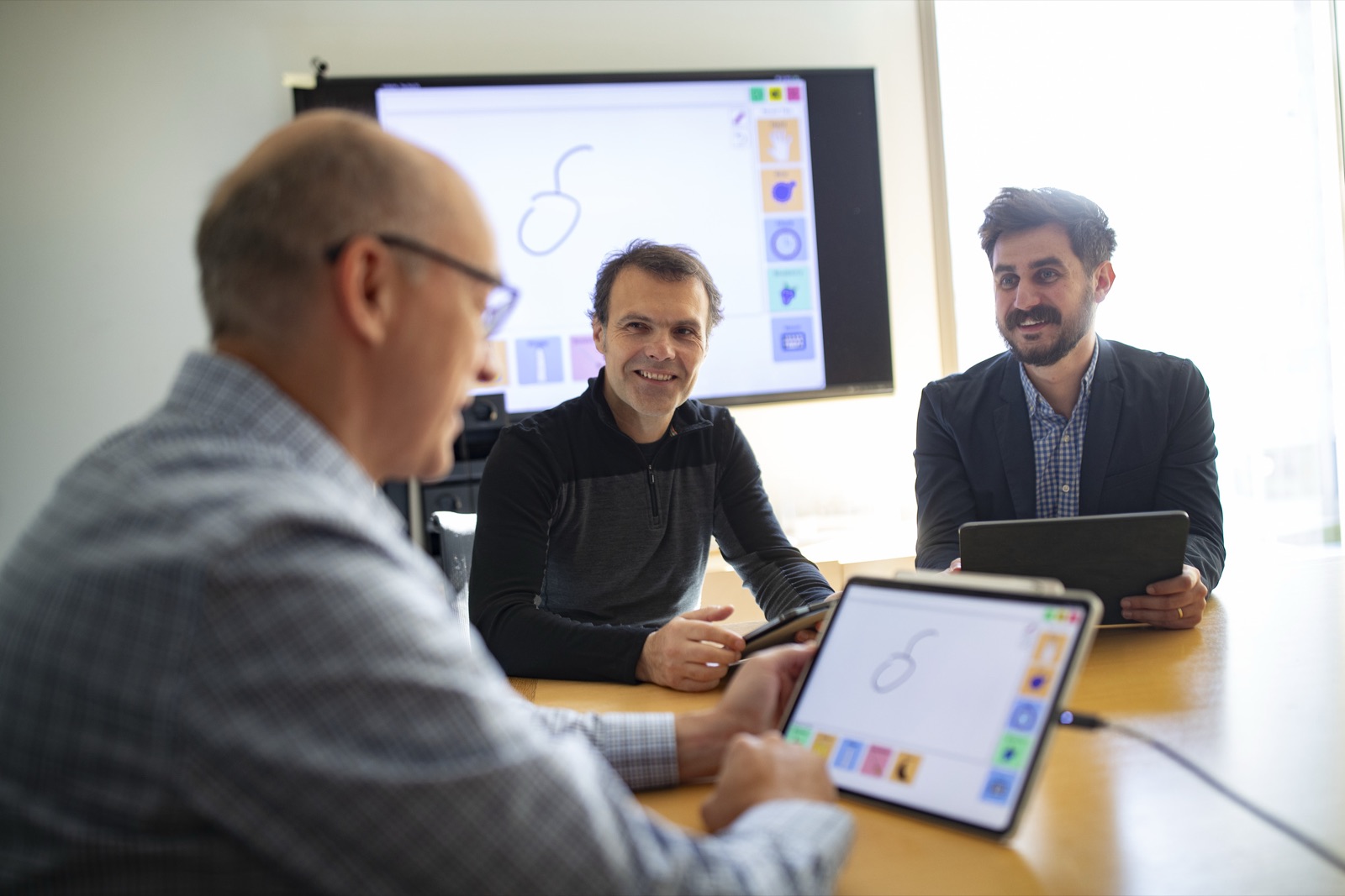 CHI faculty Slobodan Vucetic, Eduard Dragut, and Stephen MacNeil with one of their prototype AAC devices